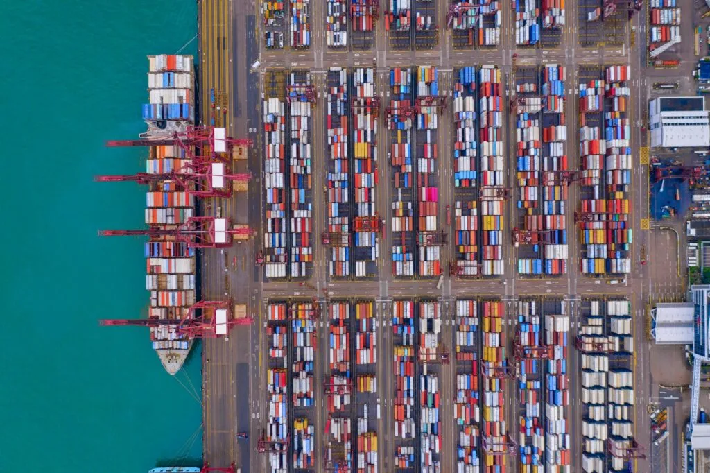 container cargo ship in the export and import business and logistics. Shipping to the harbor